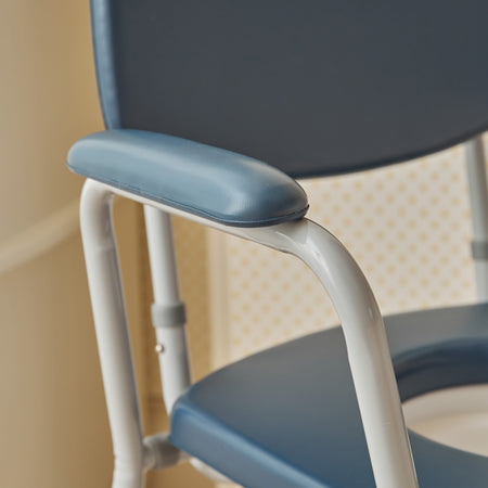 Close-up of NRS Dovedale Comfort Commode seat ring and supportive arms, showing comfort and stability.