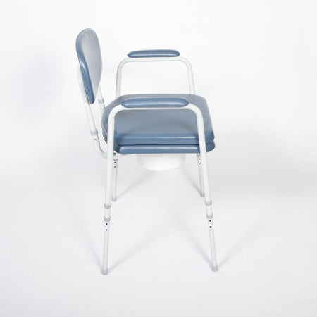 NRS Dovedale Comfort Commode in use in a home setting, with lid open to illustrate accessibility and convenience.