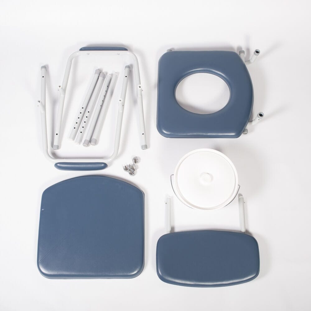 Person emptying or cleaning the commode pan of NRS Dovedale Comfort Commode into a standard toilet.