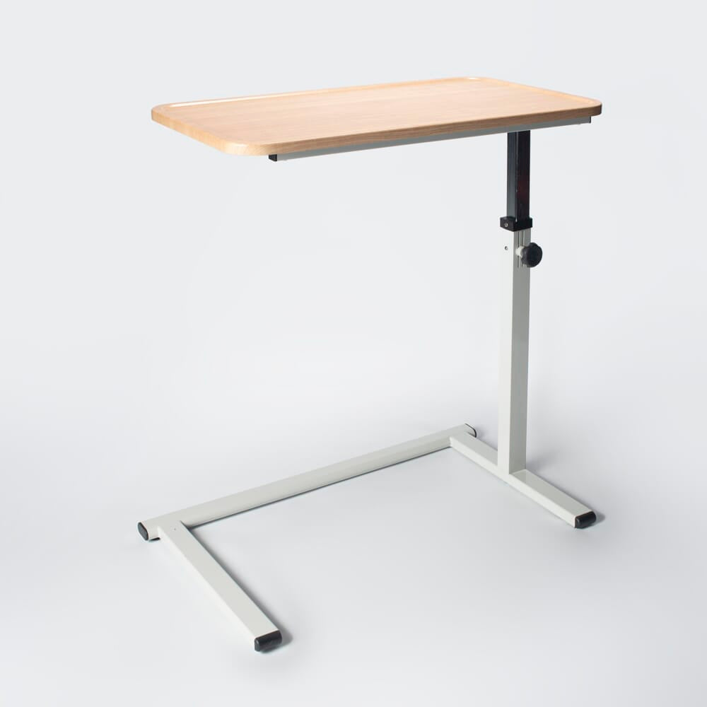 Close-up of hands adjusting the height or tilt of NRS Easylift Home Height Adjustable Overchair Table, showing the easy-turn knobs.