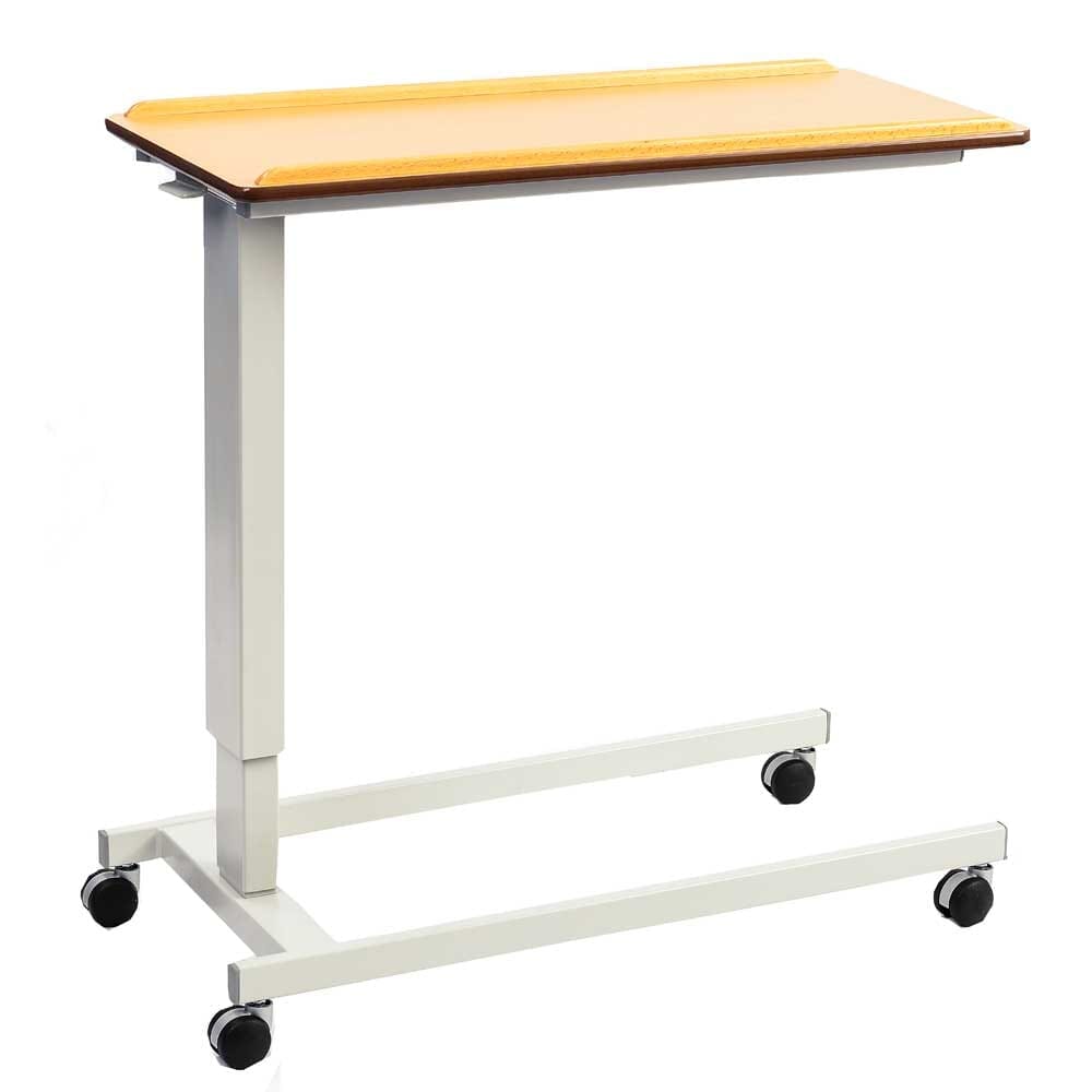 Front view of NRS Easylift Overbed Table with the table top tilted, showing the raised lips and attractive beech finish.