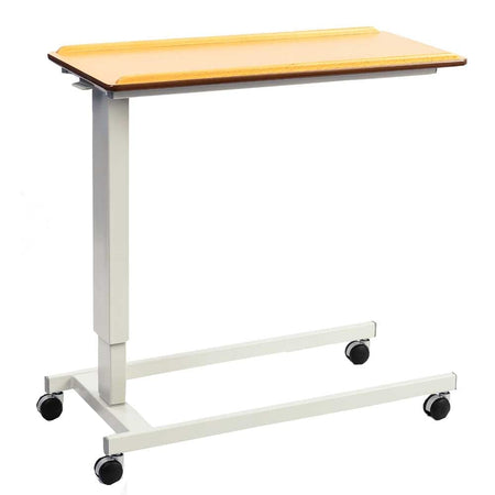 Front view of NRS Easylift Overbed Table with the table top tilted, showing the raised lips and attractive beech finish.