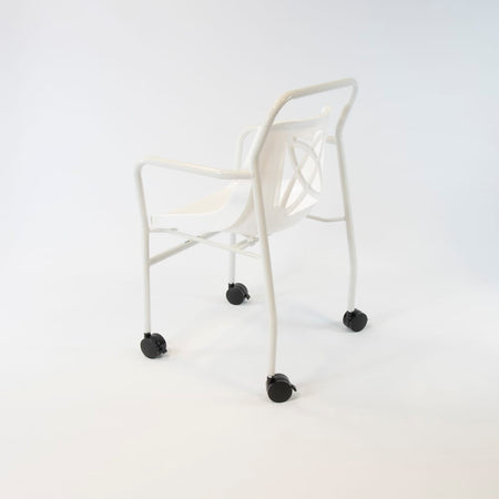 Close-up of the seat on NRS Economy Mobile Shower Chair, showing drainage holes and textured surface for comfort.