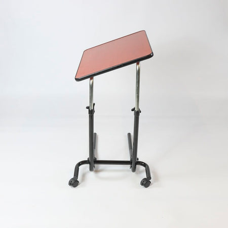 Side view of NRS Economy Overbed Table showing the tilting top and height-adjustable chrome stems.