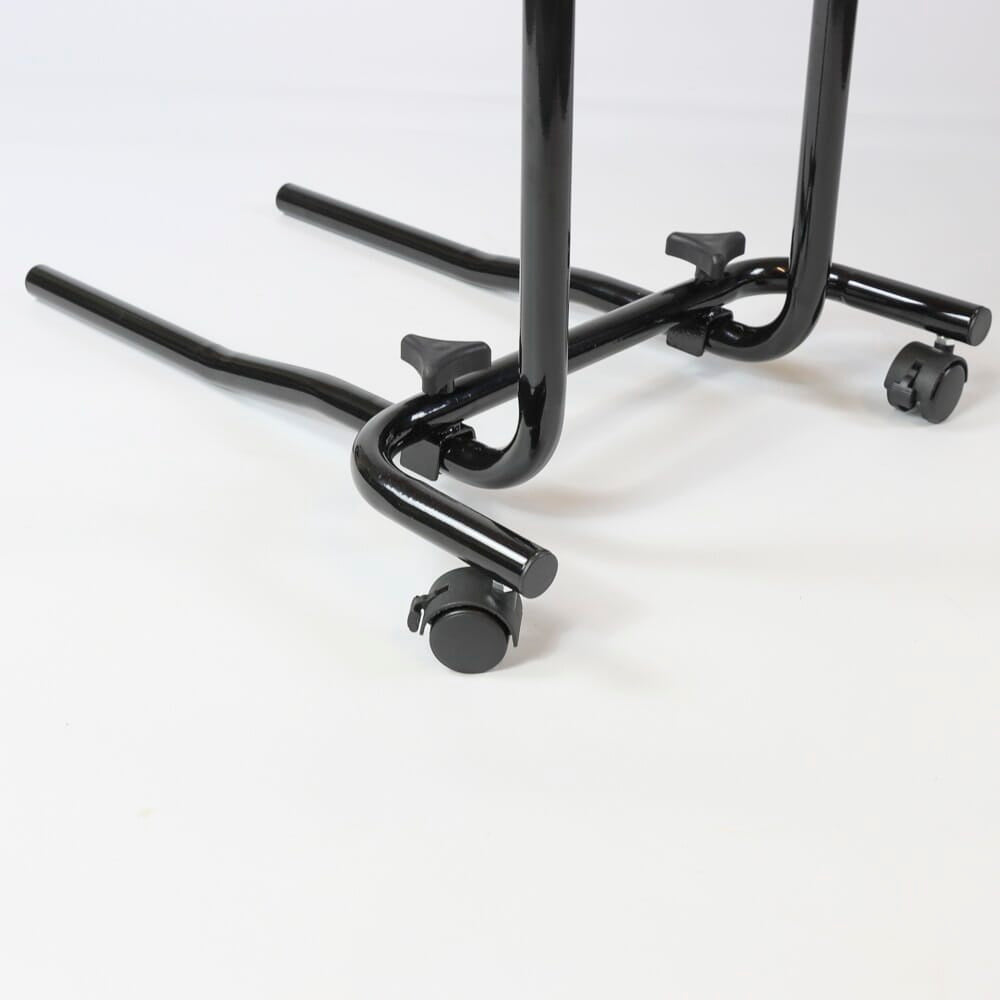 Close-up of a push button or knob on NRS Economy Overbed Table's frame used for adjusting height or tilt.