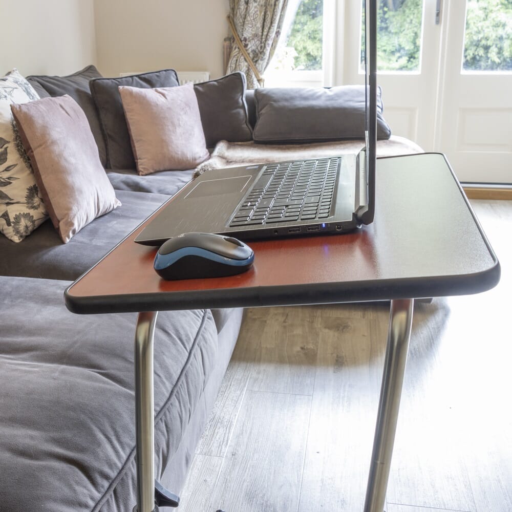 Close-up of the tubular base of NRS Economy Overbed Table, highlighting the sturdy steel frame.