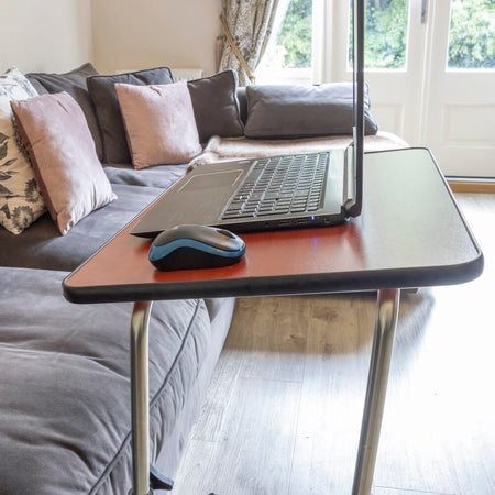 Close-up of the tubular base of NRS Economy Overbed Table, highlighting the sturdy steel frame.