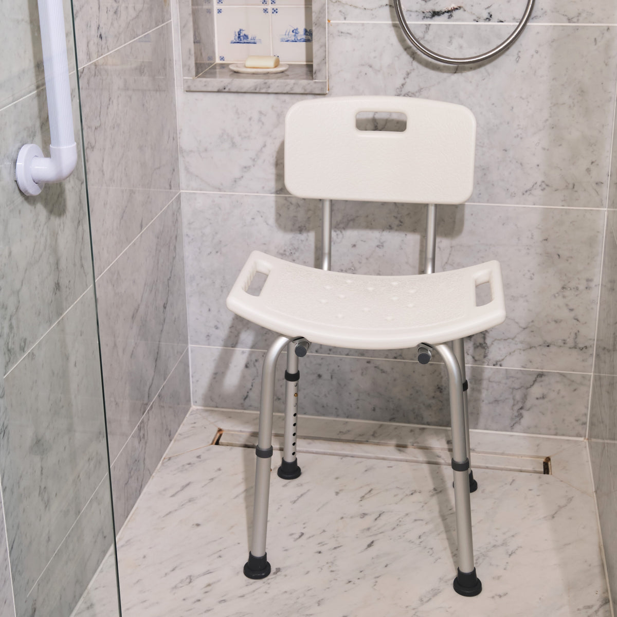 Angled view of NRS Economy Shower Chair with moulded seat, supportive backrest and height-adjustable legs on a plain background.