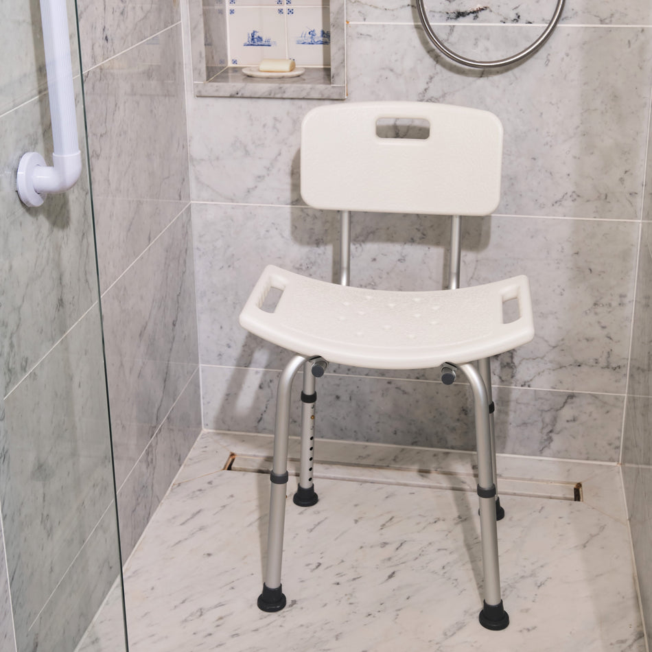 Angled view of NRS Economy Shower Chair with moulded seat, supportive backrest and height-adjustable legs on a plain background.