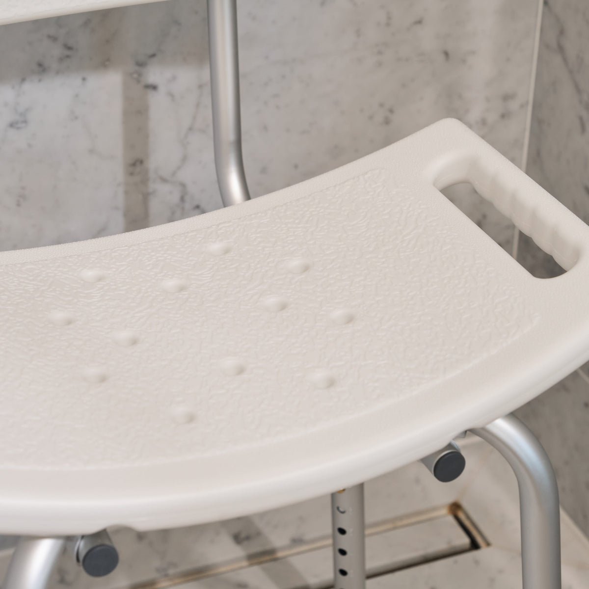 Side view of NRS Economy Shower Chair highlighting the seat height, optional armrests and sturdy aluminium legs.