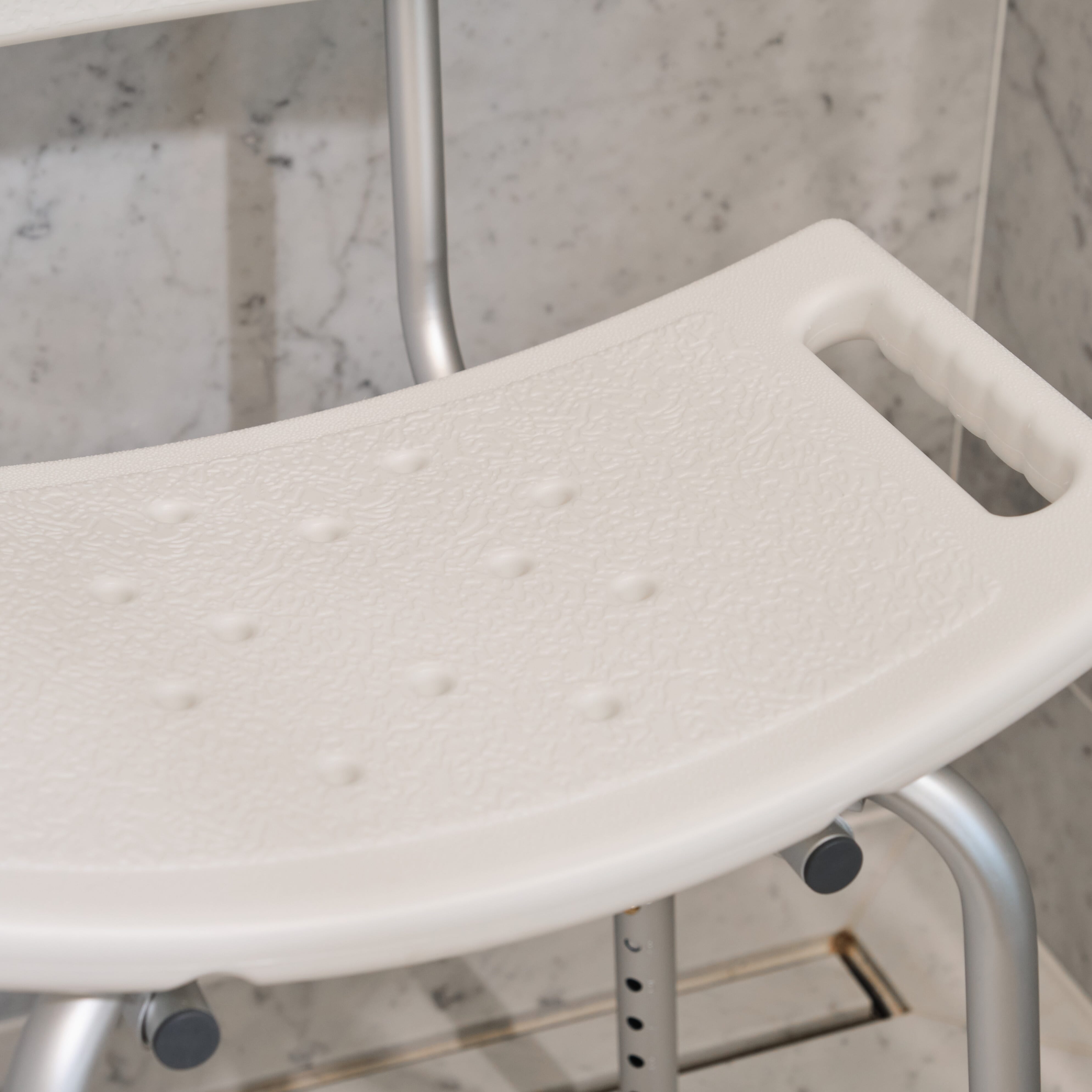 Side view of NRS Economy Shower Chair highlighting the seat height, optional armrests and sturdy aluminium legs.