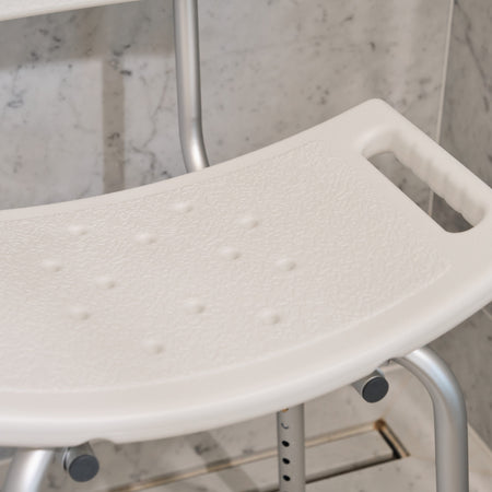 Side view of NRS Economy Shower Chair highlighting the seat height, optional armrests and sturdy aluminium legs.