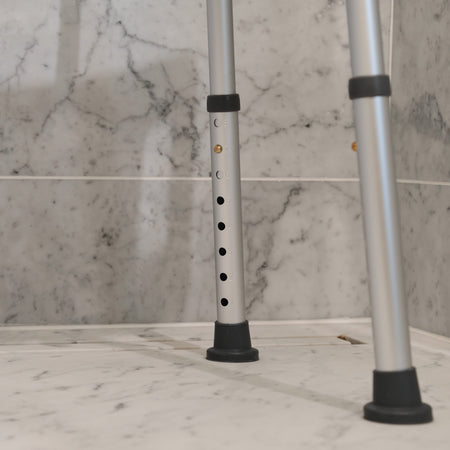 Close-up of the seat on NRS Economy Shower Chair, showing drainage holes and textured surface for comfort.