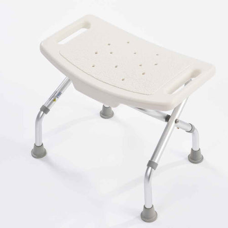 Top view of NRS Foldable Shower Stool showing drainage holes in the seat for quick water runoff.