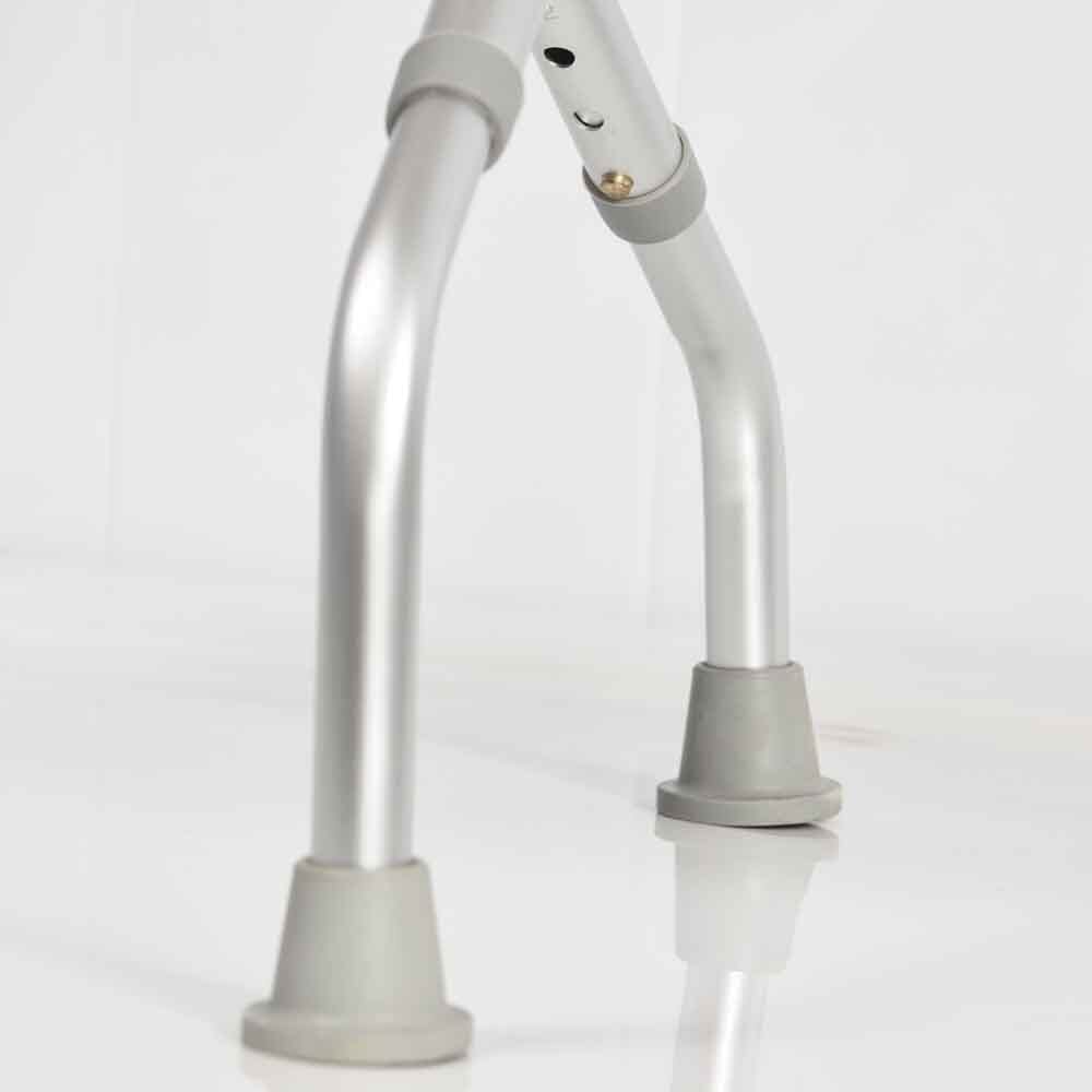 Close-up of a leg on NRS Foldable Shower Stool shower stool, showing the height adjustment holes and rubber ferrule.