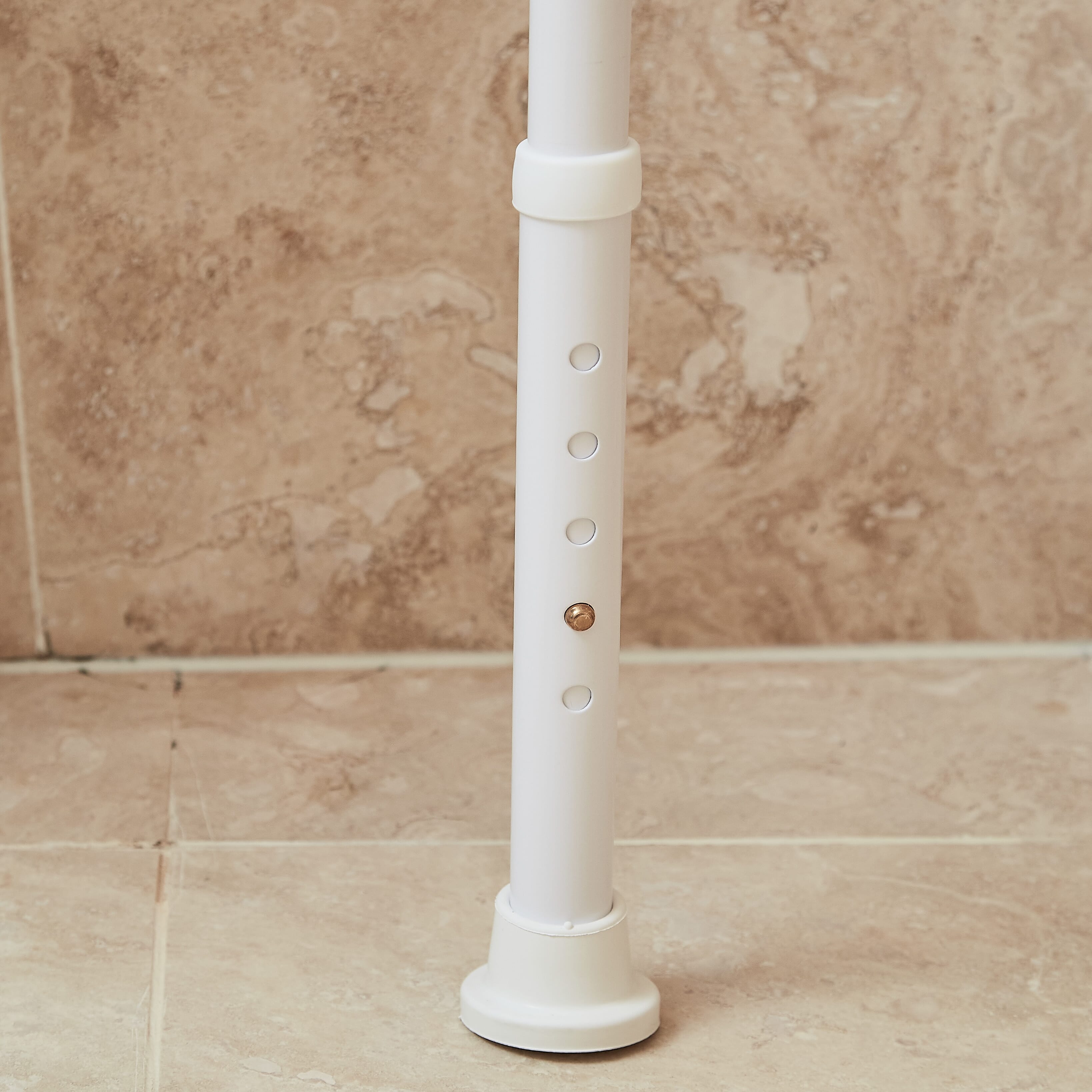 Close-up of the seat on NRS Folding Shower Chair, showing drainage holes and textured surface for comfort.