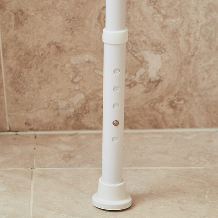 Close-up of the seat on NRS Folding Shower Chair, showing drainage holes and textured surface for comfort.