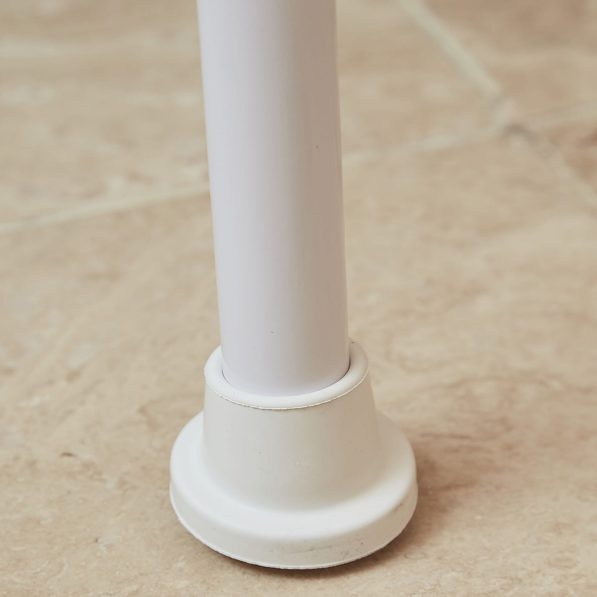 Close-up of a leg on NRS Folding Shower Chair, highlighting the height adjustment mechanism and non-slip rubber ferrule.