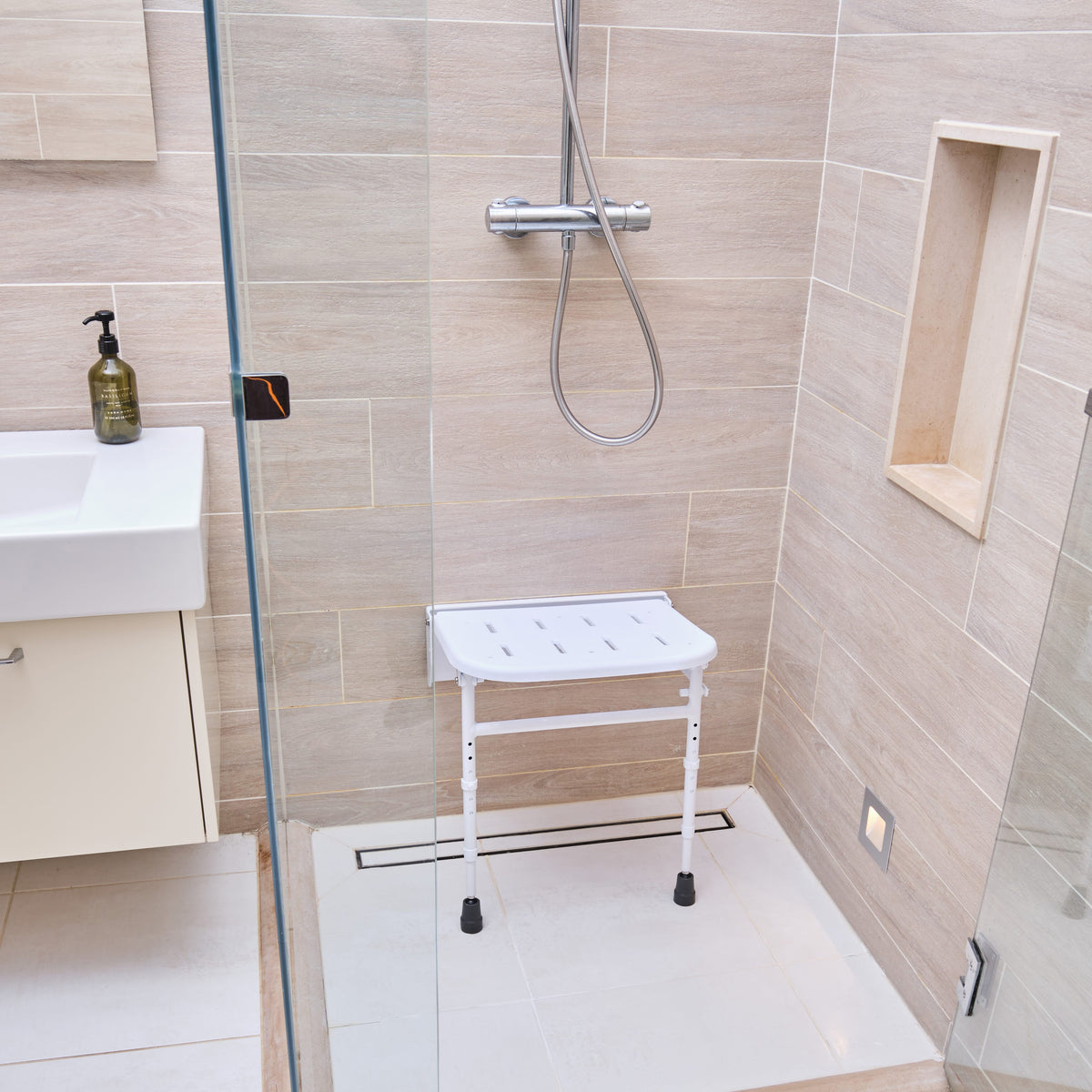 Image of NRS Folding Shower Seat with Legs on a plain background.