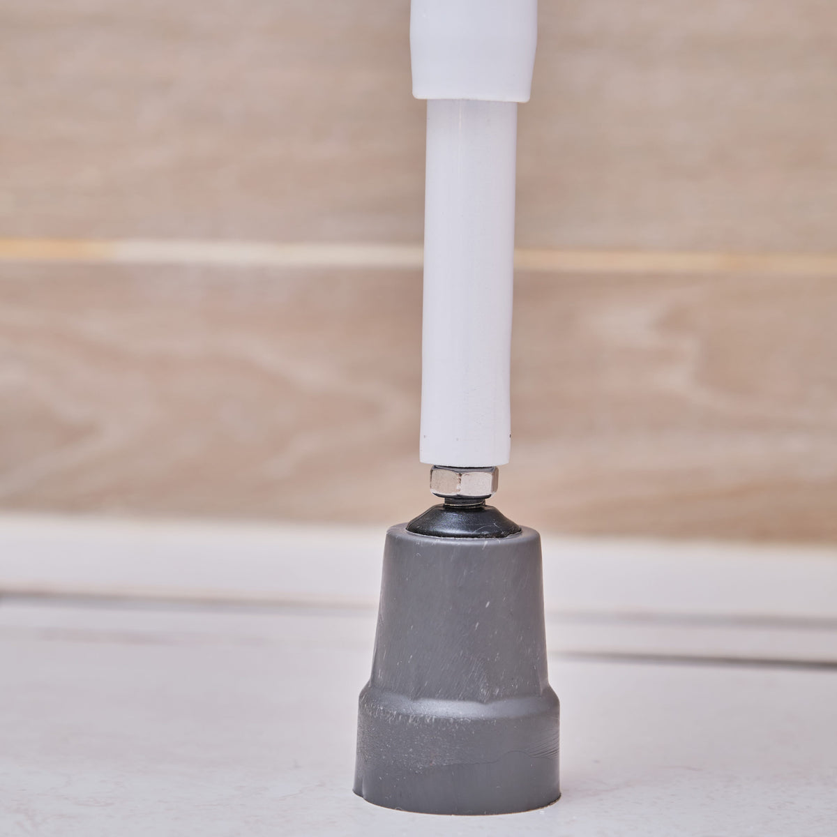 Lifestyle image of NRS Folding Shower Seat with Legs being used in a real-life setting.