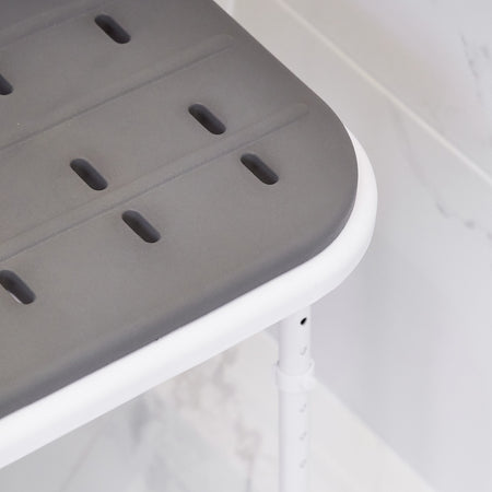 Lifestyle image of NRS Folding Shower Seat with Legs and Padded Seat being used in a real-life setting.