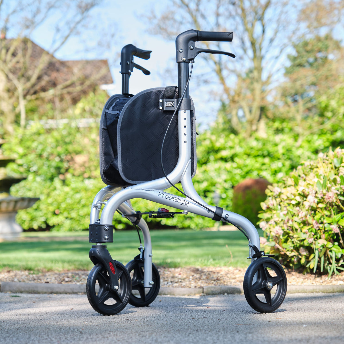 Angled view of NRS Freestyle 3 Wheel Rollator three-wheel rollator with basket or bag on a plain background.