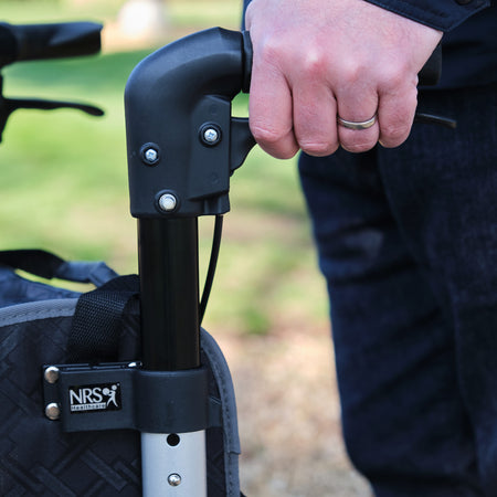 Side view of NRS Freestyle 3 Wheel Rollator three-wheel rollator, highlighting the triangular frame and rear wheels.