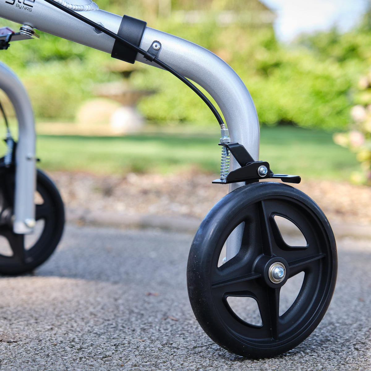 NRS Freestyle 3 Wheel Rollator three-wheel rollator folded for storage, showing its compact design.