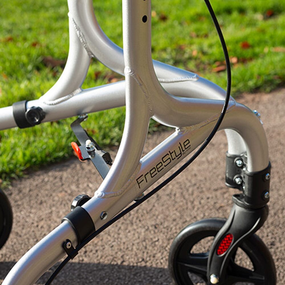 Close-up of the front wheel and fork on NRS Freestyle 3 Wheel Rollator rollator showing manoeuvrability.