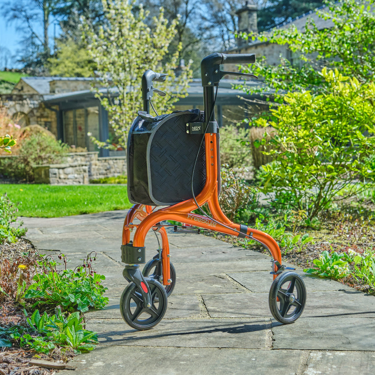 Angled view of NRS Freestyle 3 Wheel Rollator three-wheel rollator with basket or bag on a plain background.