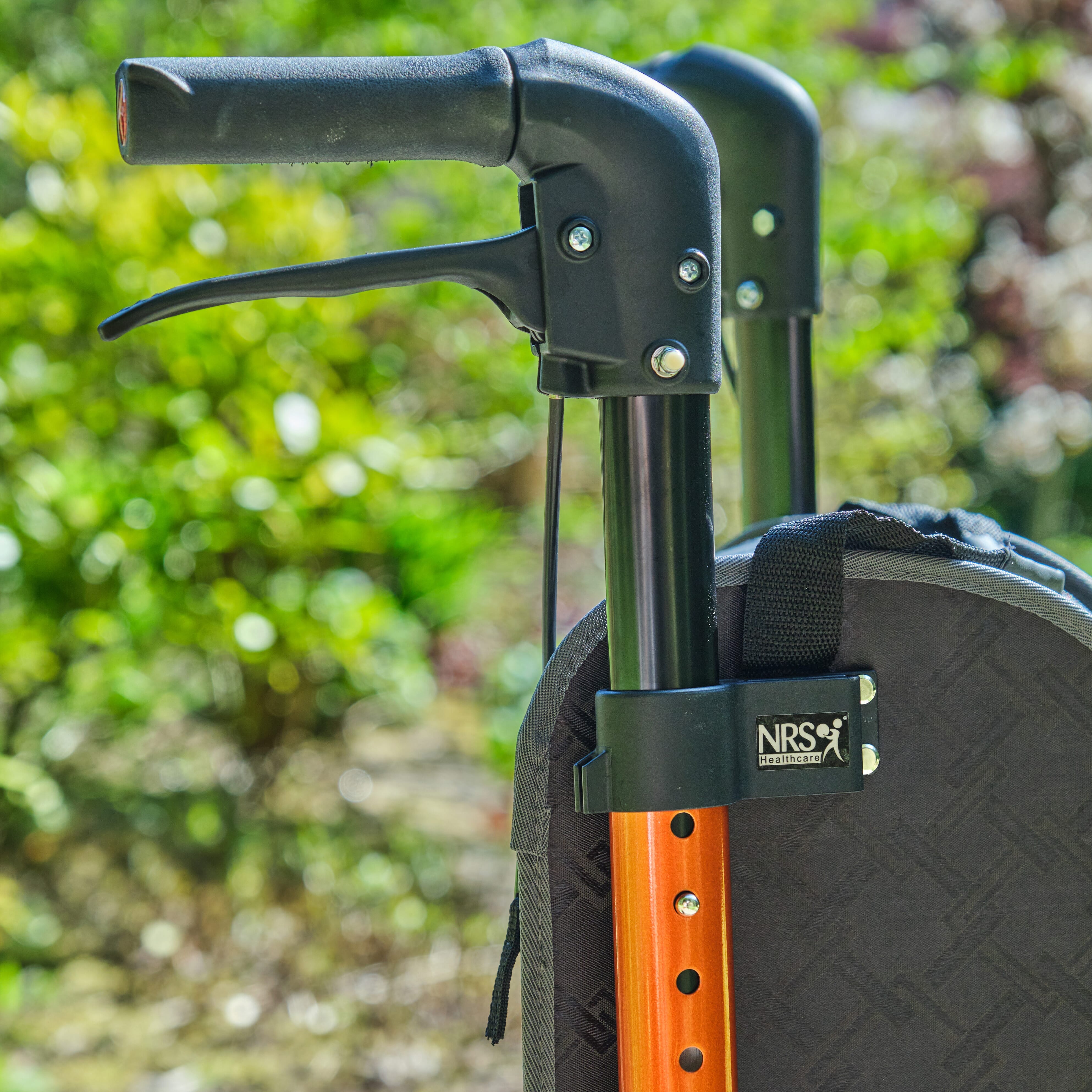 NRS Freestyle 3 Wheel Rollator three-wheel rollator folded for storage, showing its compact design.