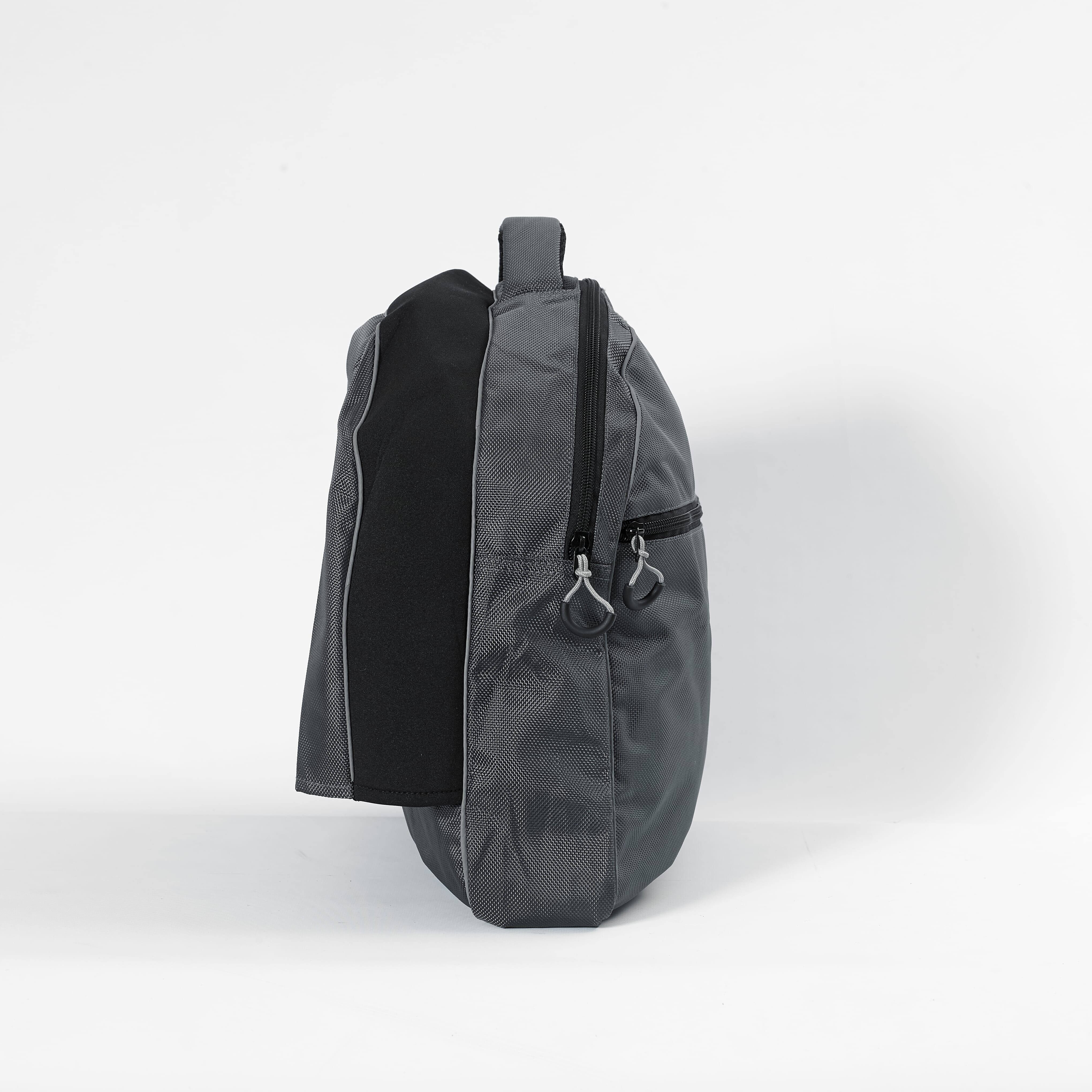 NRS Freestyle Wheelchair Dropover Bag being carried by hand or over a shoulder, illustrating its lightweight design.