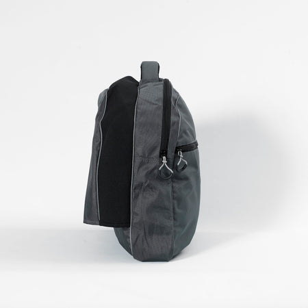 NRS Freestyle Wheelchair Dropover Bag being carried by hand or over a shoulder, illustrating its lightweight design.