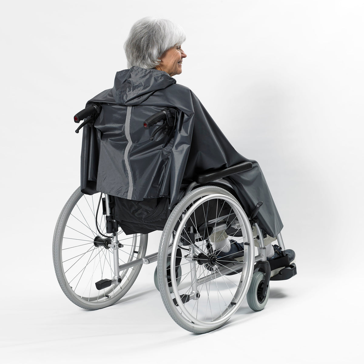 Lifestyle image of NRS Freestyle Wheelchair Poncho being used in a real-life setting.