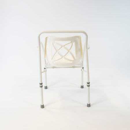 Close-up of the seat on NRS Height Adjustable Economy Shower Chair, showing drainage holes and textured surface for comfort.