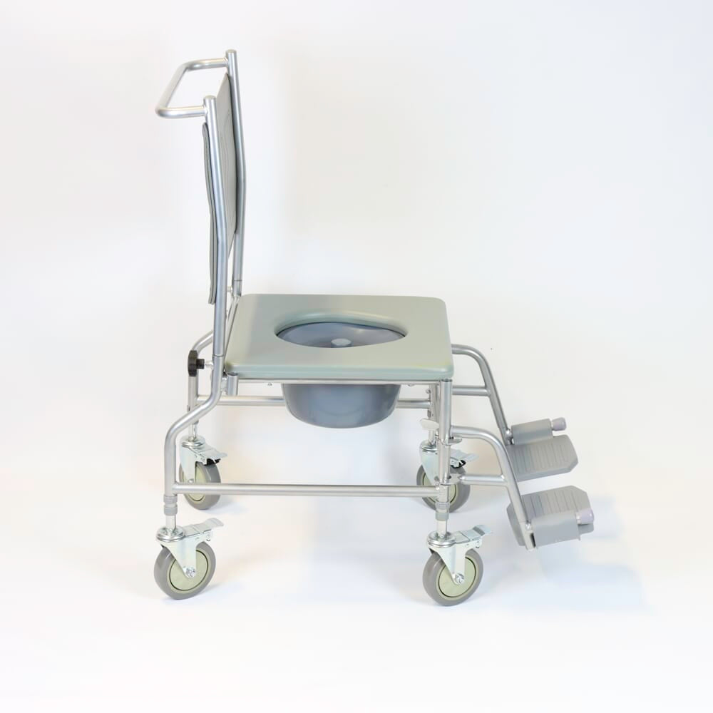 NRS Height Adjustable Wheeled Commode in use in a home setting, with lid open to illustrate accessibility and convenience.