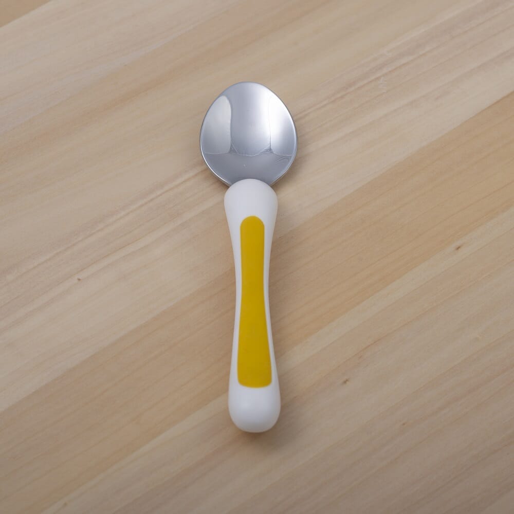Lifestyle image of NRS Kura Care Junior Spoon being used in a real-life setting.
