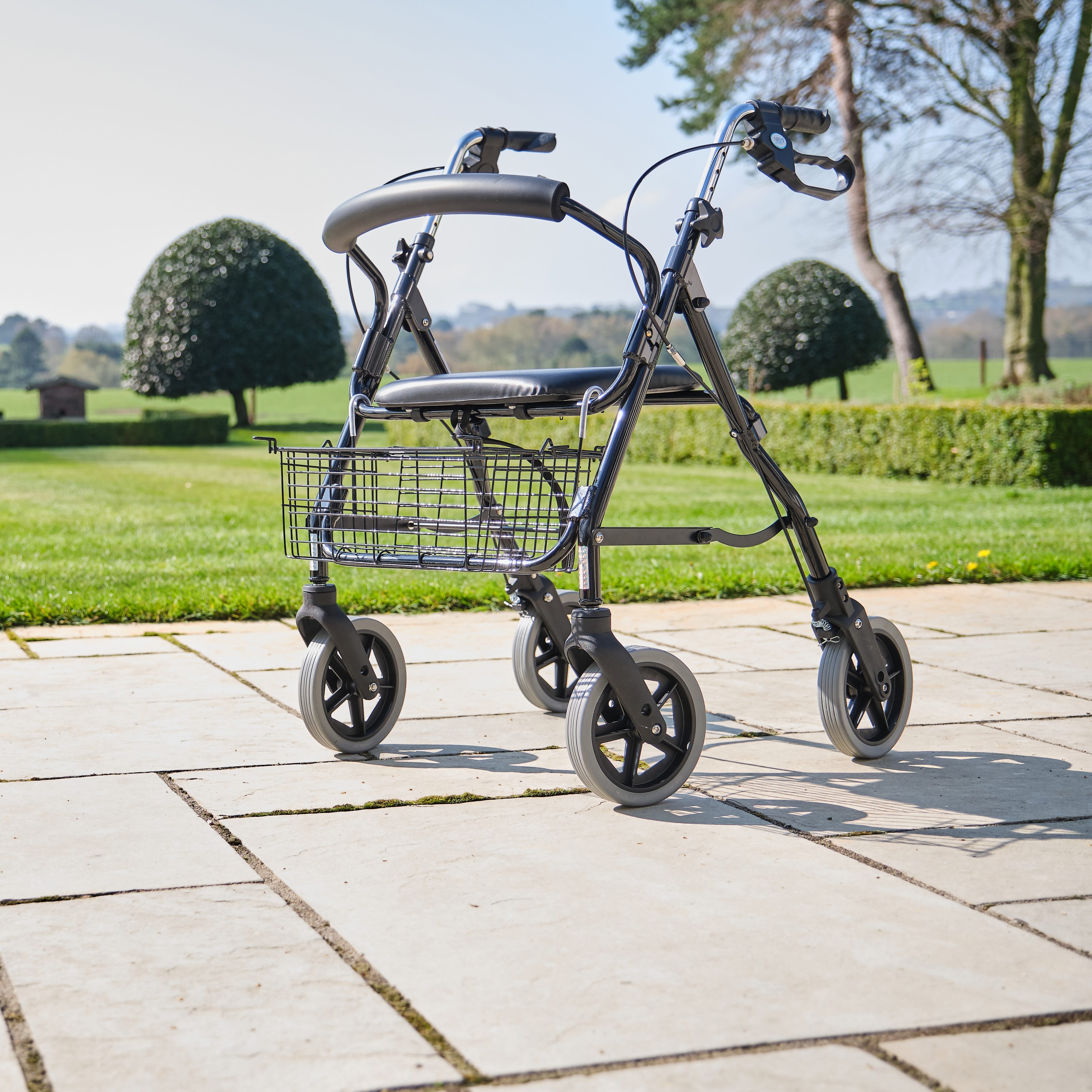 Close-up of a folding release lever on NRS Mobility Care Aluminium Rollator rollator being operated by hand.