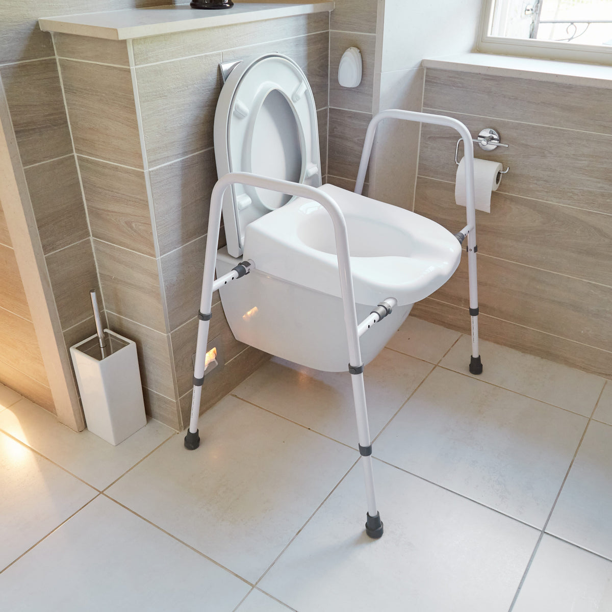 Image of NRS Mowbray Lite Adjustable Toilet Frame with Seat on a plain background.