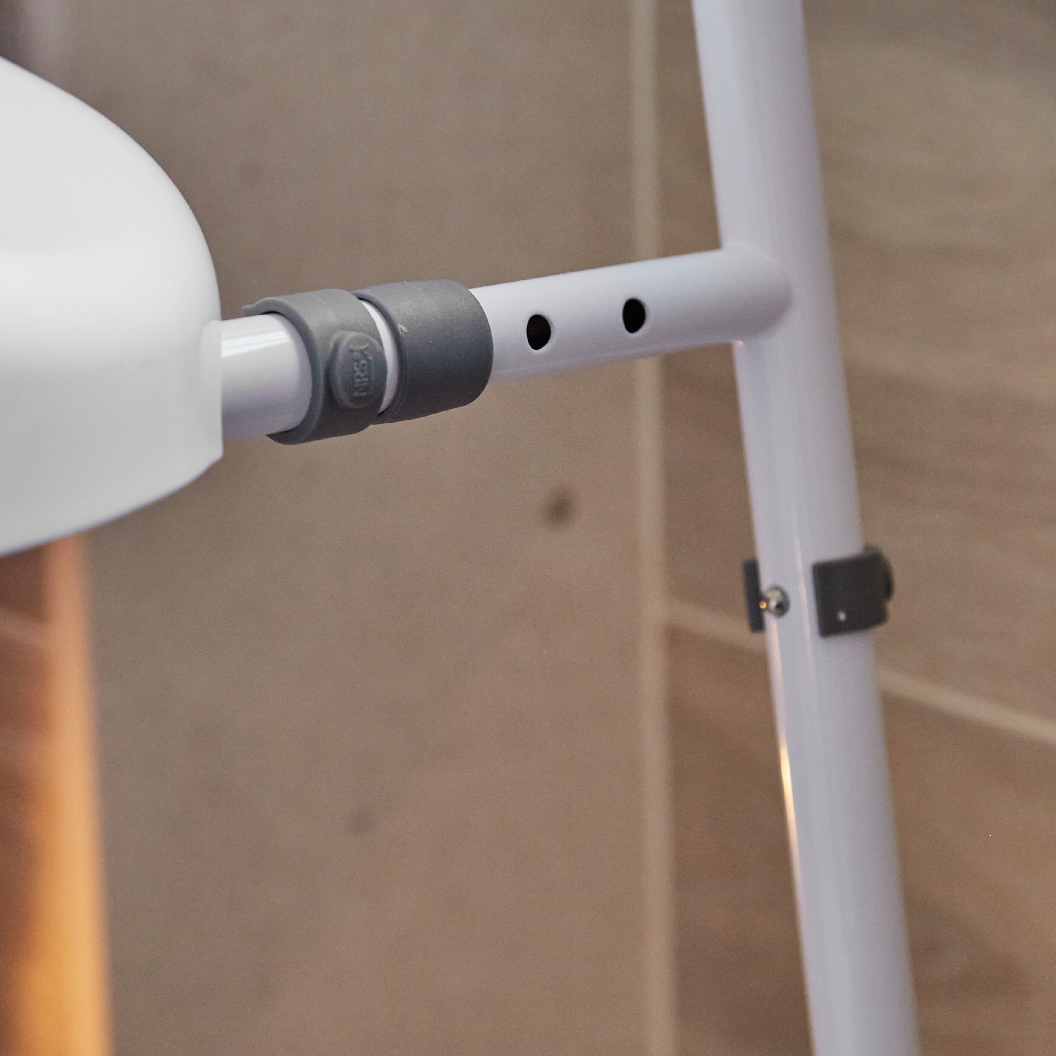 Lifestyle image of NRS Mowbray Lite Adjustable Toilet Frame with Seat being used in a real-life setting.