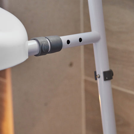 Lifestyle image of NRS Mowbray Lite Adjustable Toilet Frame with Seat being used in a real-life setting.