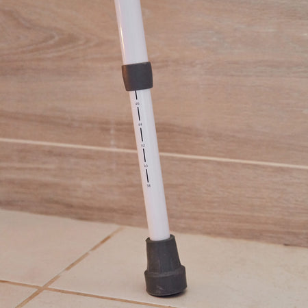 Diagram or packaging of NRS Mowbray Lite Adjustable Toilet Frame with Seat highlighting dimensions or features.