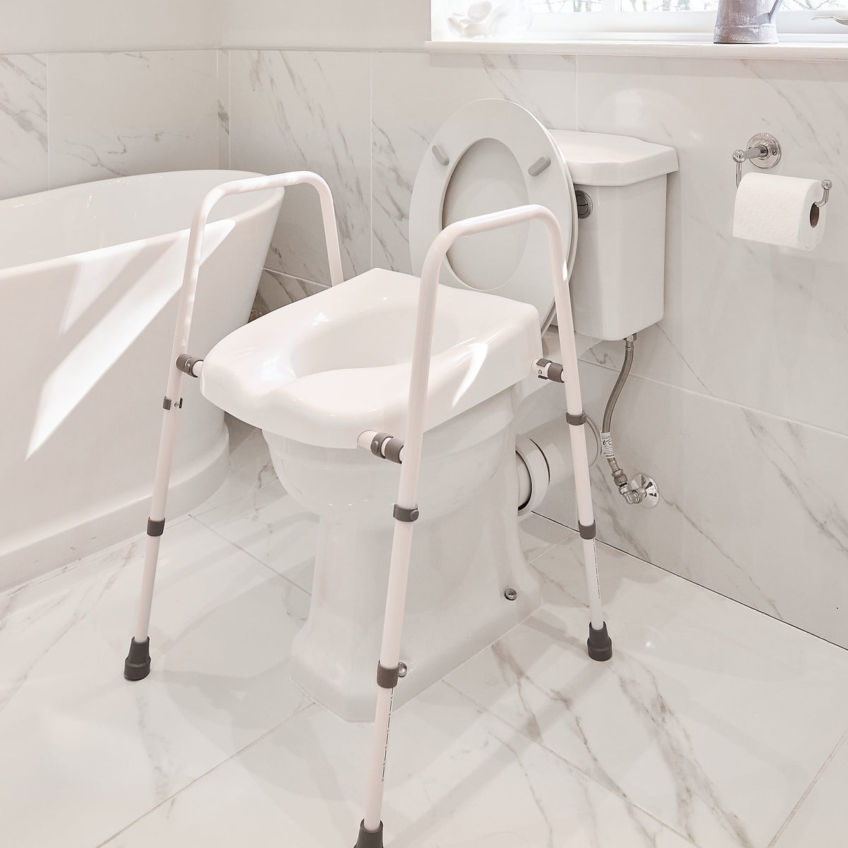Lifestyle image of NRS Mowbray Lite Toilet Frame Seat-Width Adjustable being used in a real-life setting.