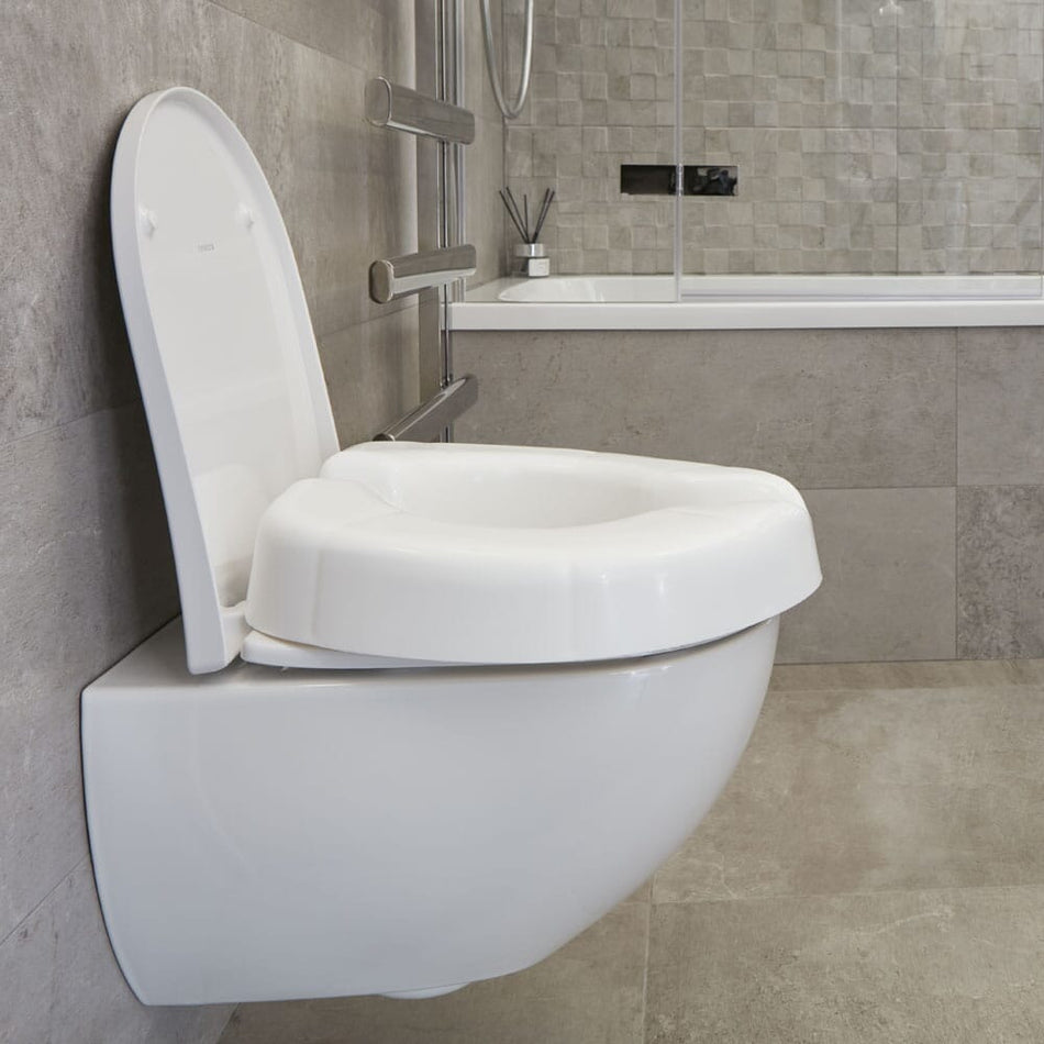 Image of NRS Novelle Clip On Raised Toilet Seat on a plain background.