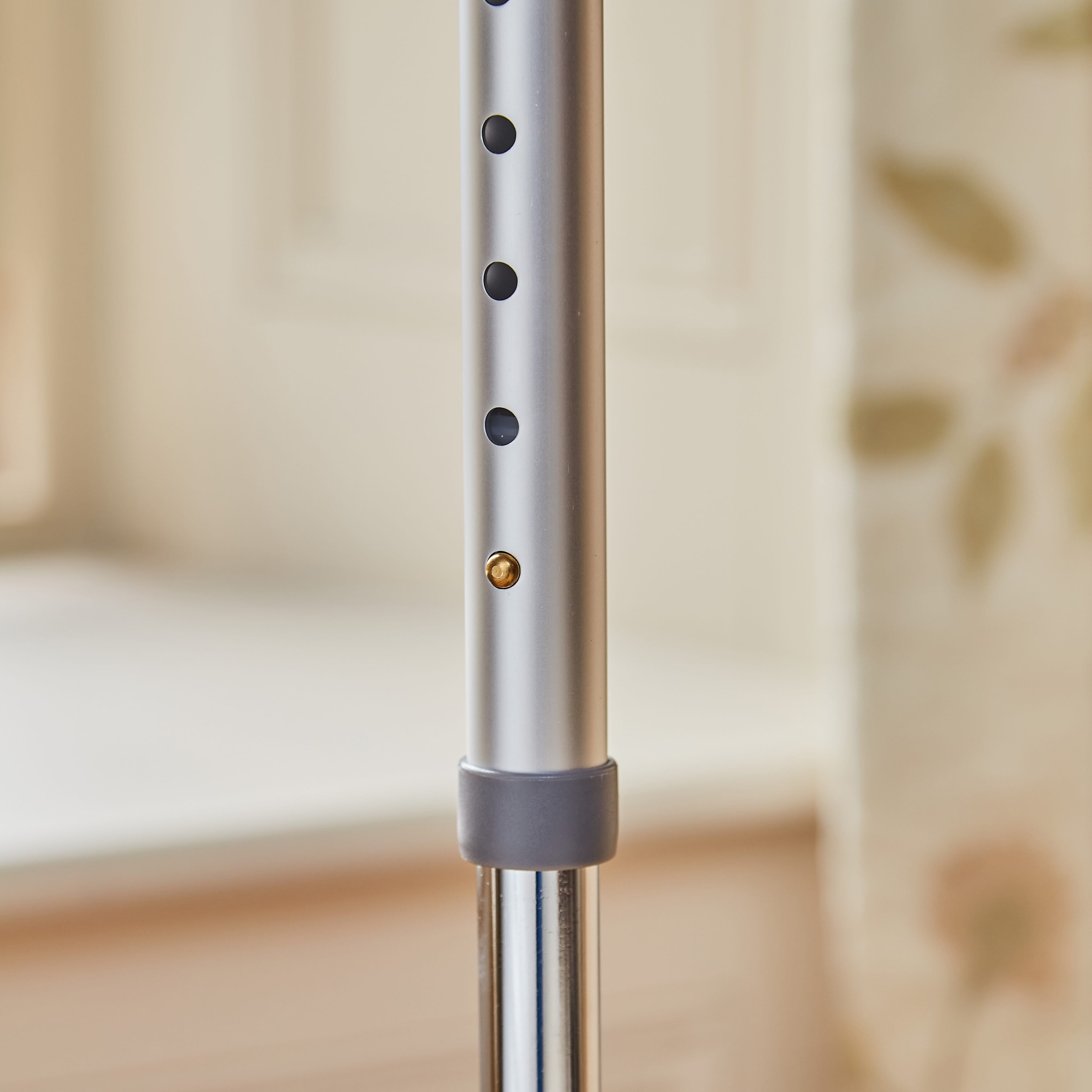 Close-up of the ferrule or base of NRS Quad Base Walking Stick walking stick, showing the non-slip tip.