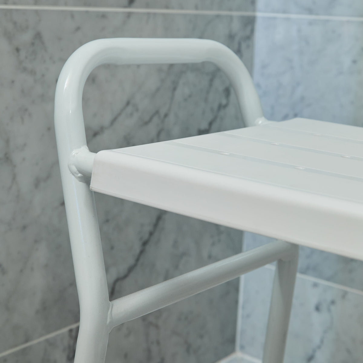Side view of NRS Shower Stool With Handles highlighting the lightweight aluminium legs and non-slip ferrules.