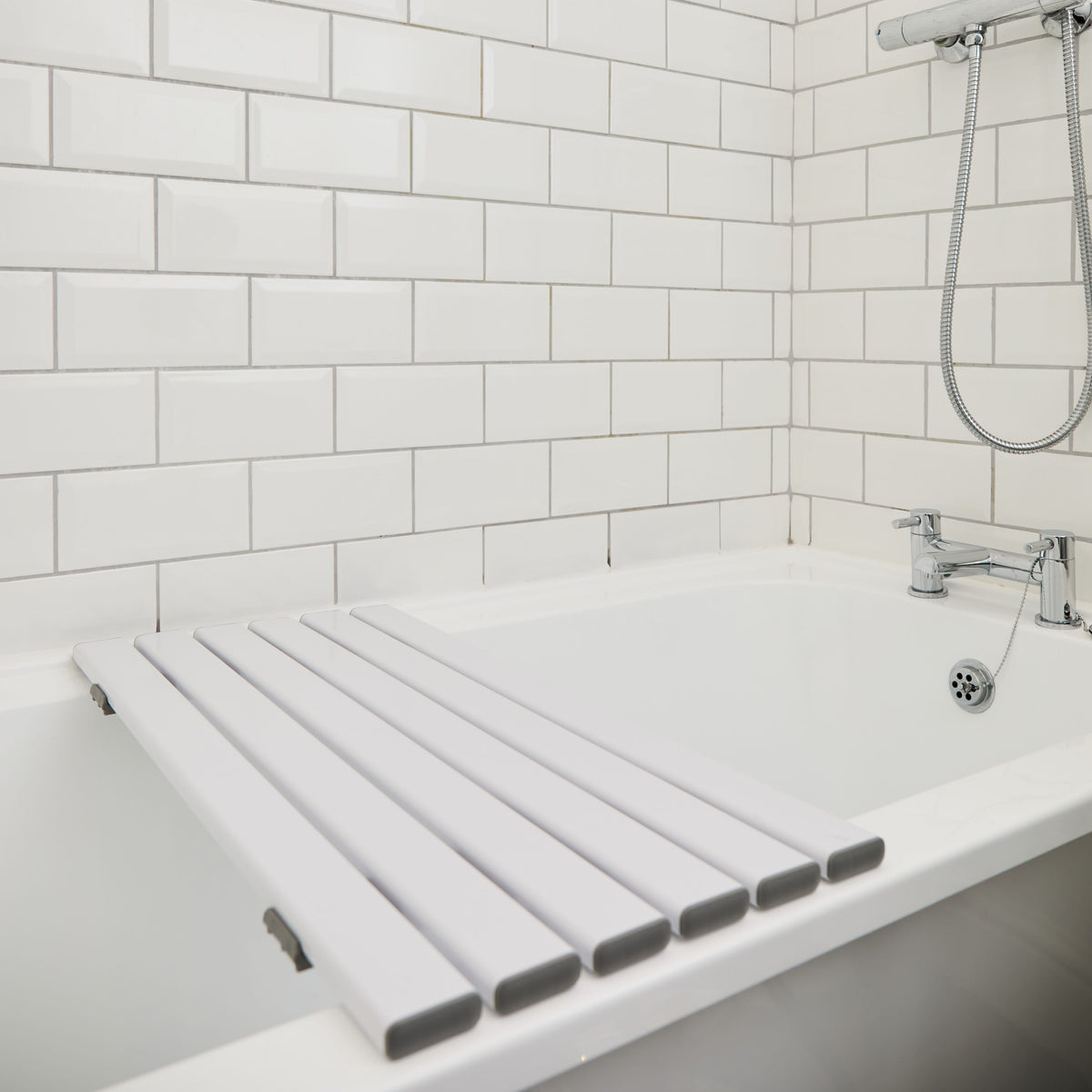 Full view of NRS Slatted Shower Board bath board showing slatted seat, integral handle and adjustable brackets on a plain background.