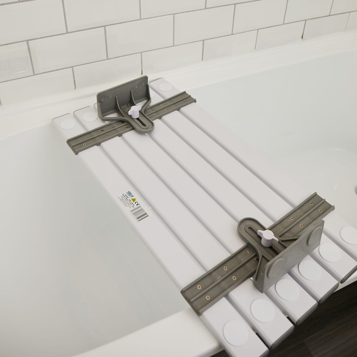 Close-up of the textured, slip-resistant surface or drainage holes on NRS Slatted Shower Board bath board.