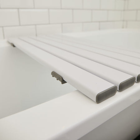 Close-up of the adjustable bracket or clamp on NRS Slatted Shower Board bath board, showing how it fits securely to the bath.