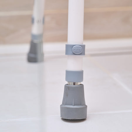 Front view of NRS Stackable Adjustable Shower Chair showing drainage holes in the seat and the supportive backrest design.